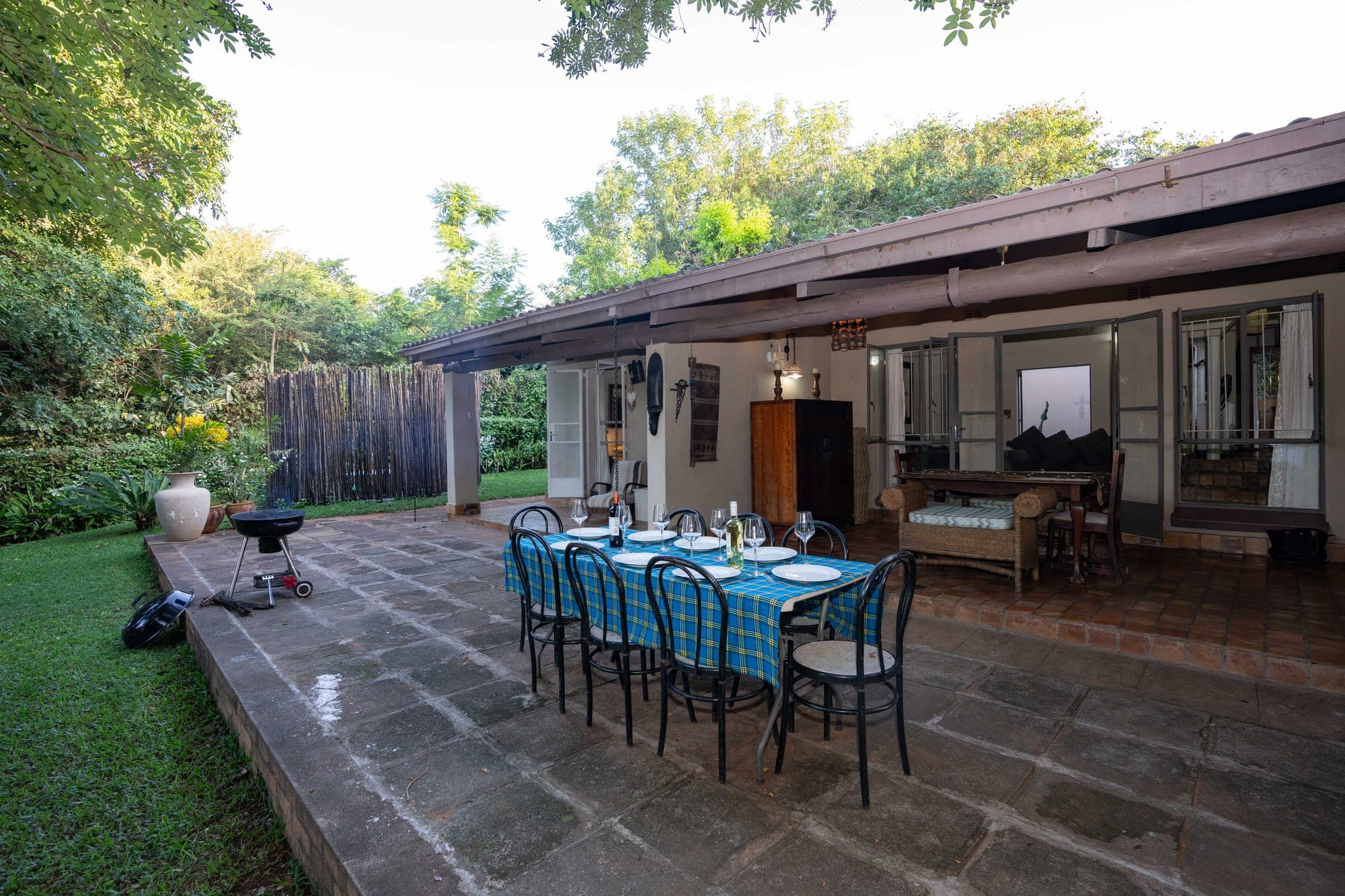 Outdoor dining table on the veranda at sunset